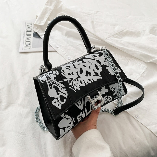 Graffiti painted leather crossbody bag