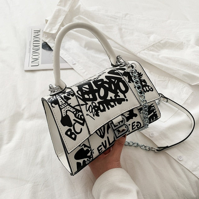 Graffiti painted leather crossbody bag