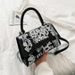 Graffiti painted leather crossbody bag